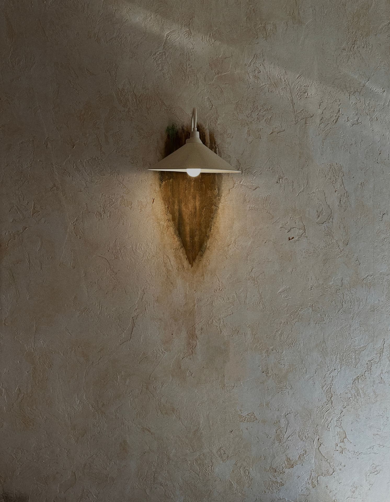 Grey textured wall with geometric light