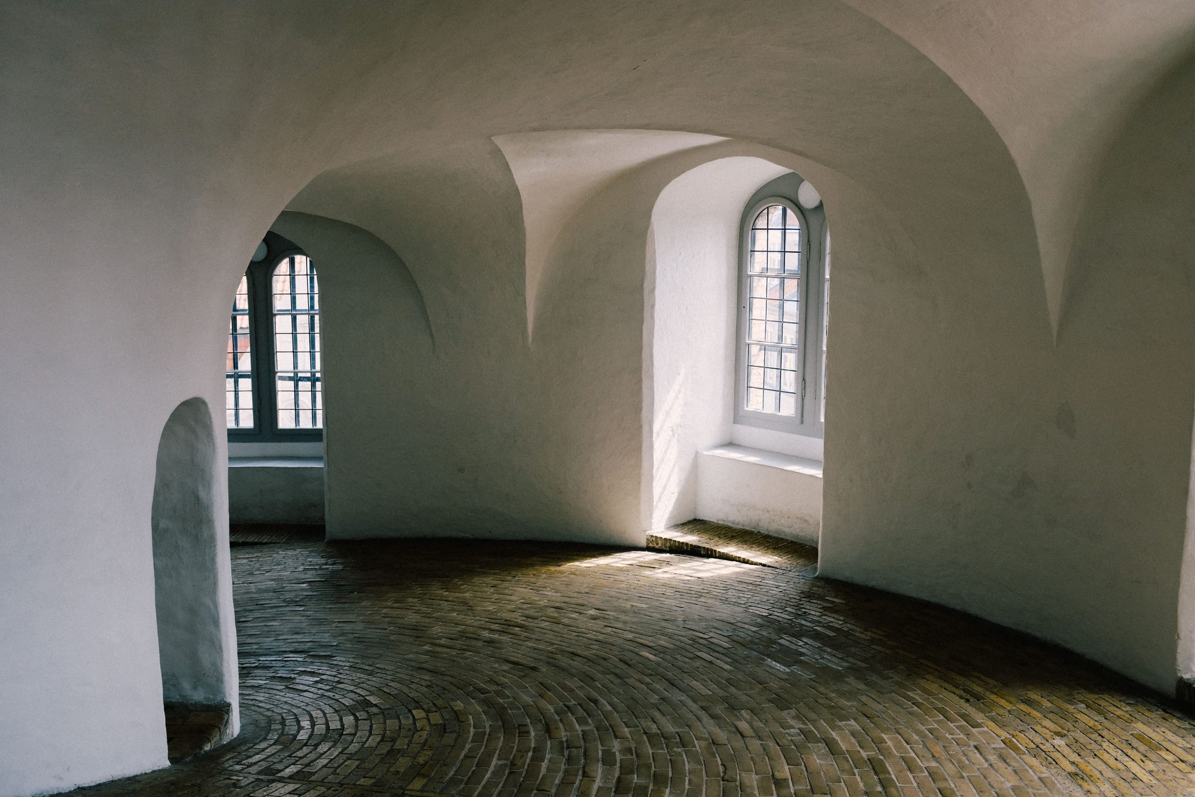 Pale plaster interior with vaulted ceiling