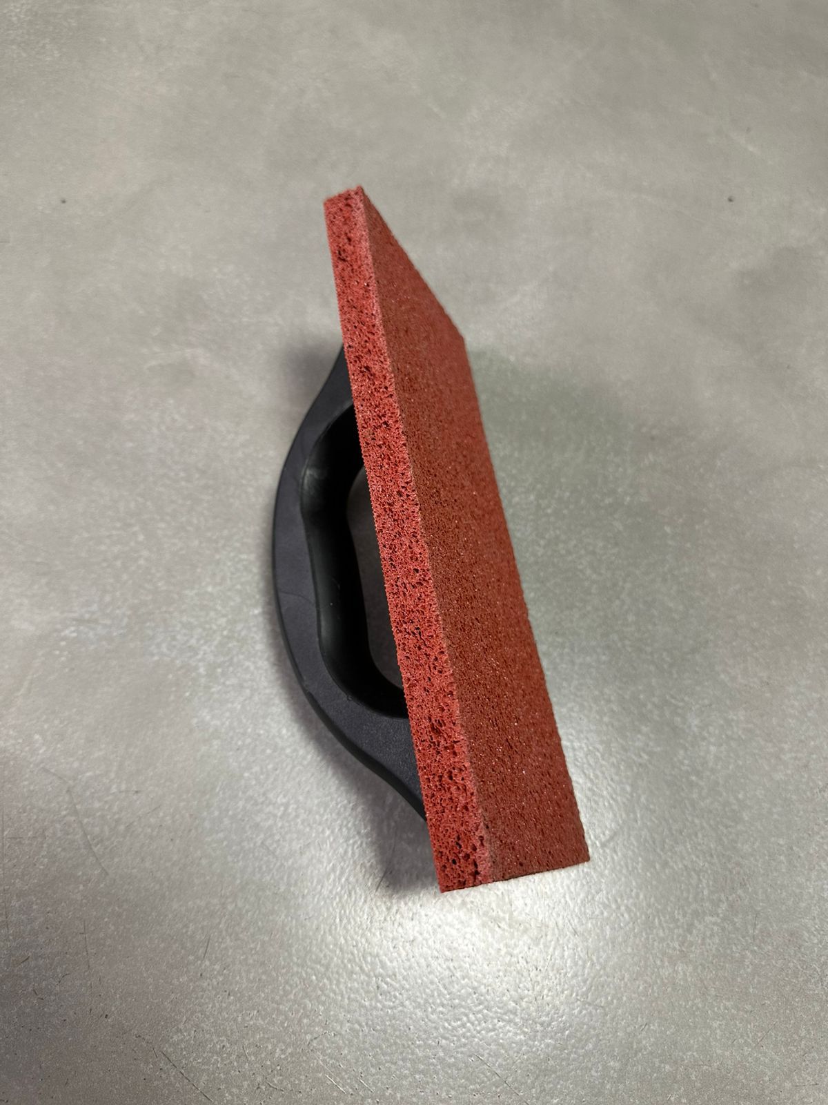 Red plastering float with black handle